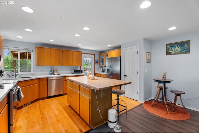 3218 SW Corbeth Ln, Troutdale, OR 97060 - kitchen with appliances with stainless steel finishes, light wood-style floors, plenty of natural light, butcher block counters, and recessed lighting