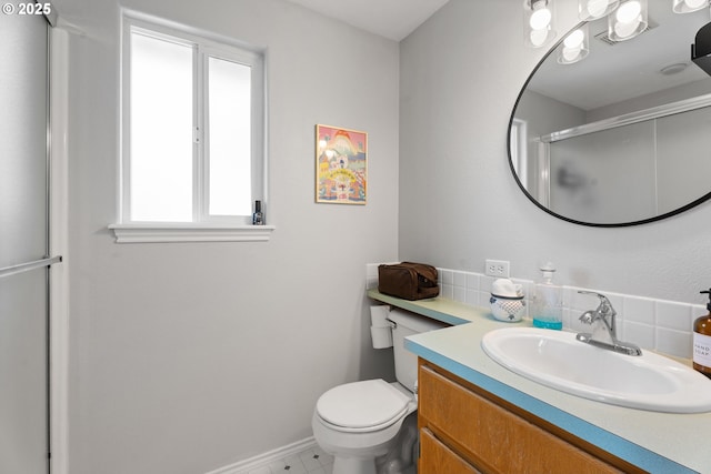 3218 SW Corbeth Ln, Troutdale, OR 97060 - full bath with tasteful backsplash, vanity, toilet, a shower with shower door, and baseboards