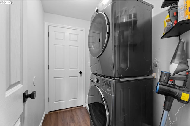 3218 SW Corbeth Ln, Troutdale, OR 97060 - washroom featuring stacked washing machine and dryer and wood finished floors