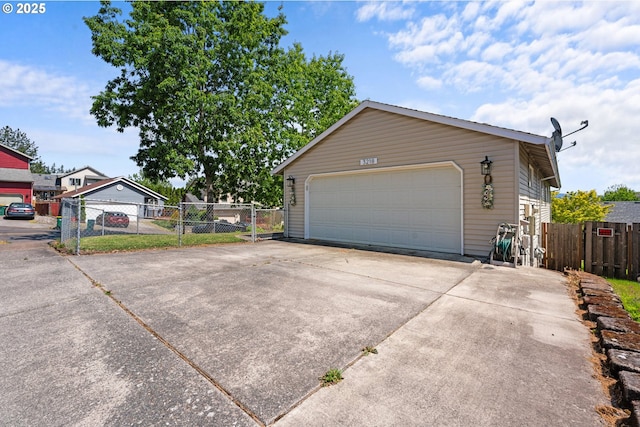 3218 SW Corbeth Ln, Troutdale, OR 97060 - view of home's exterior with a garage and fence