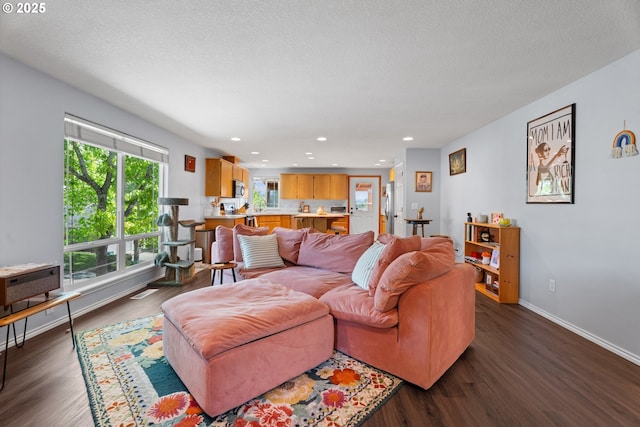 3218 SW Corbeth Ln, Troutdale, OR 97060 - living area with dark wood-style flooring, recessed lighting, and baseboards