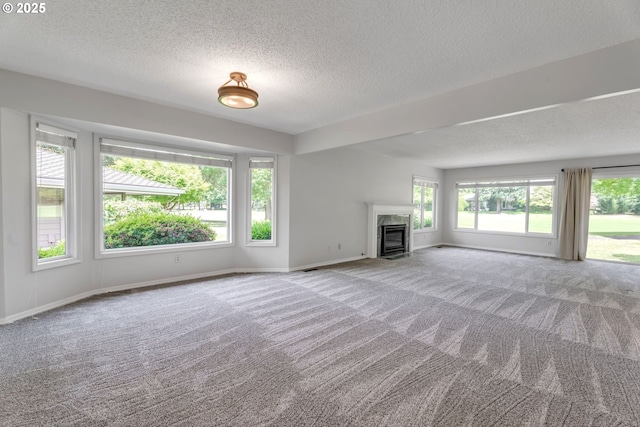 8085 SW Fairway Dr, Wilsonville, OR 97070 - unfurnished living room with a textured ceiling, carpet, and a premium fireplace