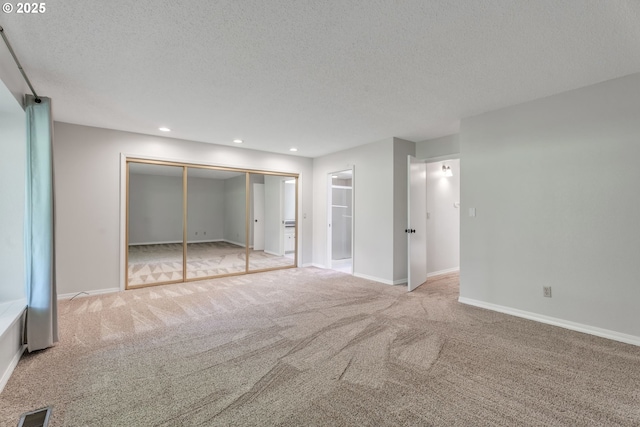8085 SW Fairway Dr, Wilsonville, OR 97070 - unfurnished bedroom featuring carpet, a textured ceiling, a closet, recessed lighting, and ensuite bath