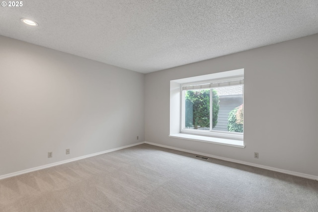 8085 SW Fairway Dr, Wilsonville, OR 97070 - unfurnished room featuring light colored carpet, a textured ceiling, and recessed lighting