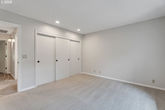 8085 SW Fairway Dr, Wilsonville, OR 97070 - unfurnished bedroom featuring carpet floors, a textured ceiling, recessed lighting, and a closet