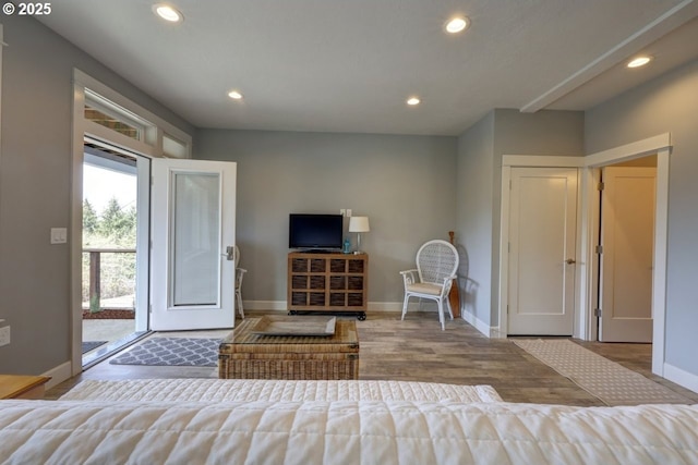 interior space featuring recessed lighting, baseboards, and wood finished floors
