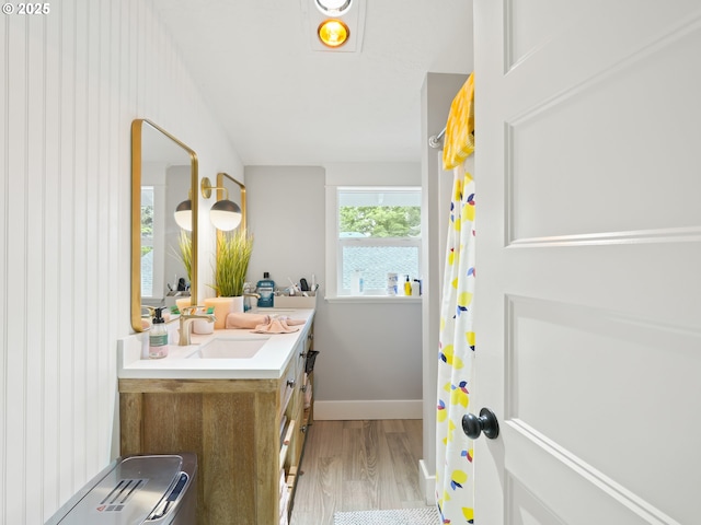 3327 4th St, Hubbard, OR 97032 - bathroom featuring wood finished floors, vanity, and baseboards