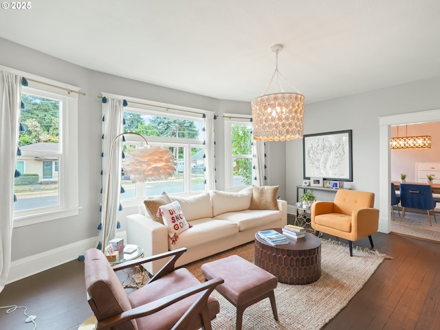 3327 4th St, Hubbard, OR 97032 - living room featuring a chandelier, plenty of natural light, and dark wood-type flooring