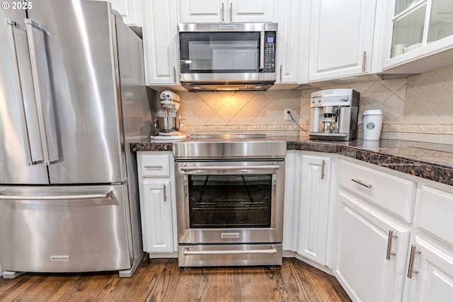 32153 SE Bluff Rd, Gresham, OR 97080 - kitchen featuring stainless steel appliances, white cabinets, dark wood-style floors, and backsplash