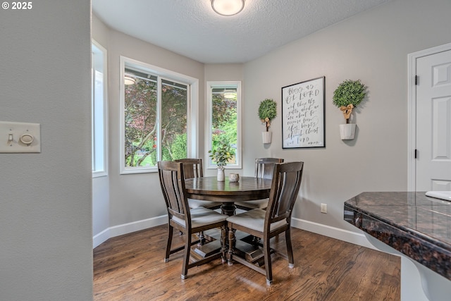 32153 SE Bluff Rd, Gresham, OR 97080 - dining area featuring dark wood-type flooring and a textured ceiling