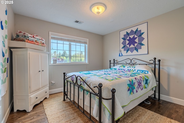 32153 SE Bluff Rd, Gresham, OR 97080 - bedroom featuring wood finished floors and a textured ceiling