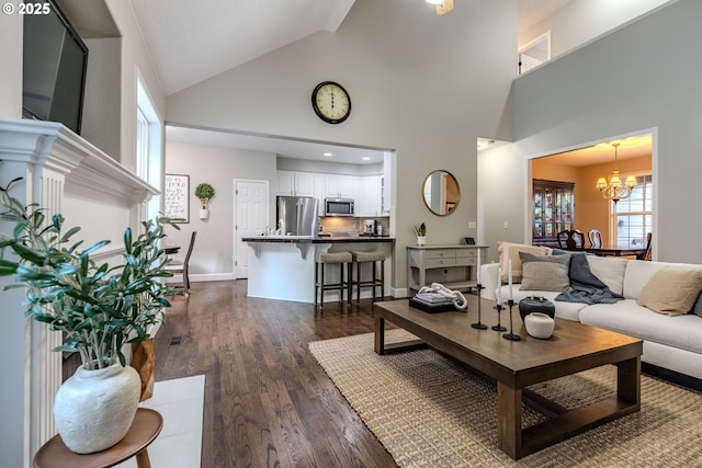 32153 SE Bluff Rd, Gresham, OR 97080 - living room featuring high vaulted ceiling, a chandelier, and dark wood-style flooring