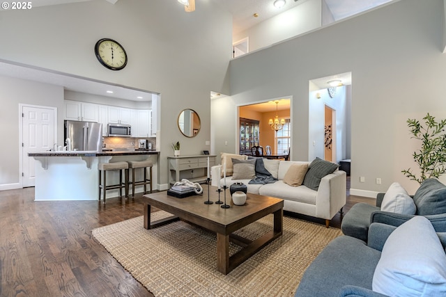 32153 SE Bluff Rd, Gresham, OR 97080 - living room featuring a chandelier, dark wood-style floors, and a high ceiling