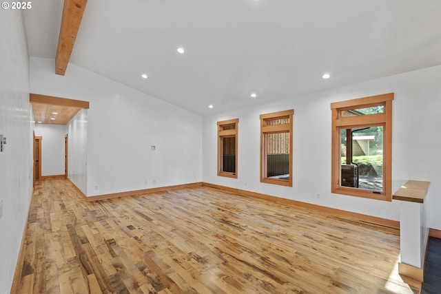 unfurnished living room with vaulted ceiling with beams, light wood-style floors, baseboards, and recessed lighting