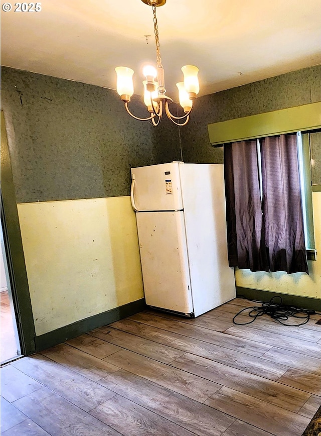 870 NE 3rd Ave, Hillsboro, OR 97124 - unfurnished dining area with hardwood / wood-style floors and a chandelier