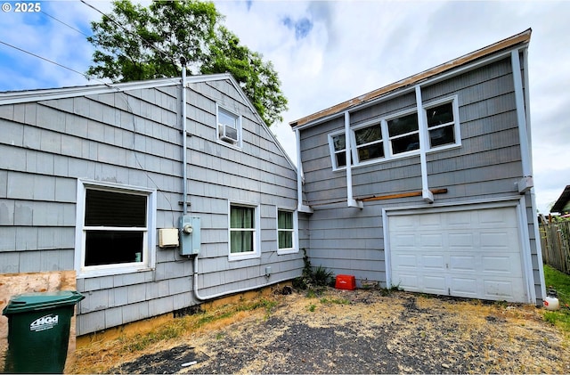 870 NE 3rd Ave, Hillsboro, OR 97124 - back of house with a garage, cooling unit, and driveway