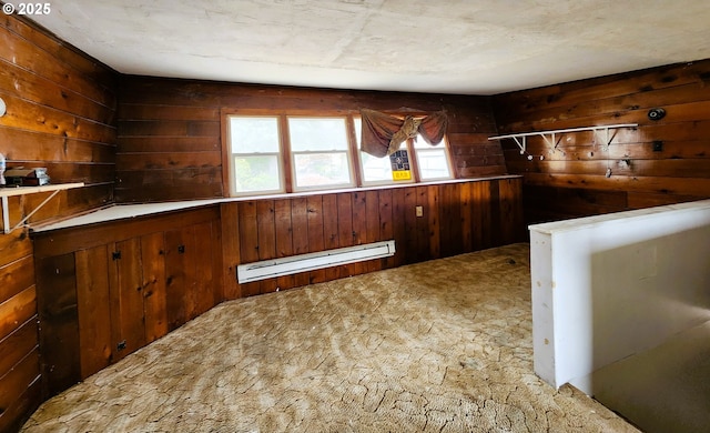 870 NE 3rd Ave, Hillsboro, OR 97124 - kitchen featuring a baseboard heating unit, wooden walls, and carpet floors