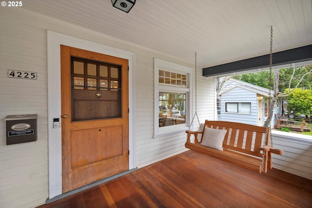 doorway to property with covered porch