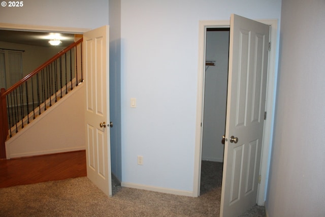 hall featuring carpet floors