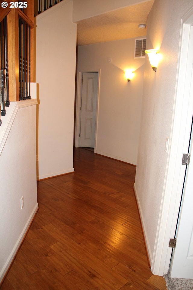 corridor with dark hardwood / wood-style floors