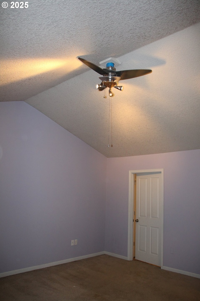 additional living space featuring lofted ceiling, ceiling fan, and carpet