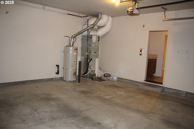 garage featuring strapped water heater and a garage door opener