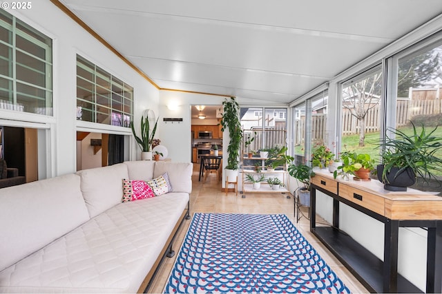 sunroom / solarium featuring lofted ceiling