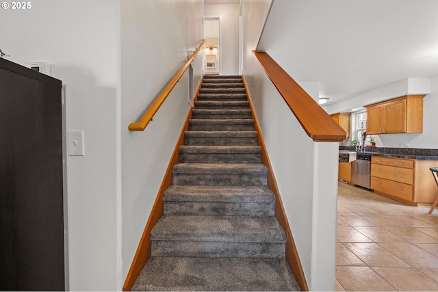 staircase with tile patterned flooring and baseboards