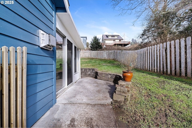 view of yard featuring a patio and a fenced backyard