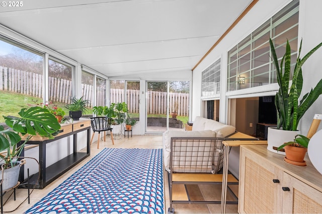 sunroom / solarium featuring lofted ceiling