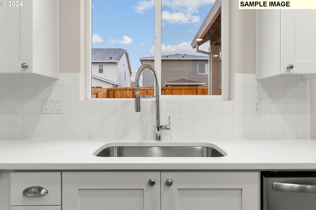 3118 S Magnolia Dr Unit Lt752, Cornelius, OR 97113 - kitchen with a sink, dishwasher, white cabinets, tasteful backsplash, and light countertops