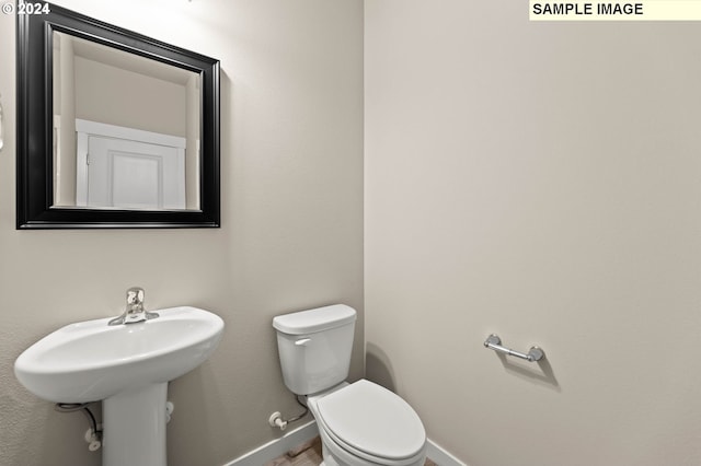 3118 S Magnolia Dr Unit Lt752, Cornelius, OR 97113 - bathroom featuring toilet, baseboards, and wood finished floors