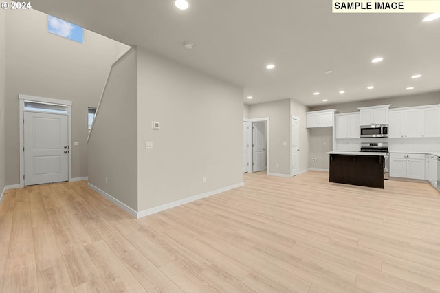 3118 S Magnolia Dr Unit Lt752, Cornelius, OR 97113 - kitchen featuring stainless steel appliances, light wood-type flooring, baseboards, white cabinets, and recessed lighting