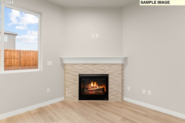 3118 S Magnolia Dr Unit Lt752, Cornelius, OR 97113 - detailed view of wood finished floors, a tiled fireplace, and baseboards