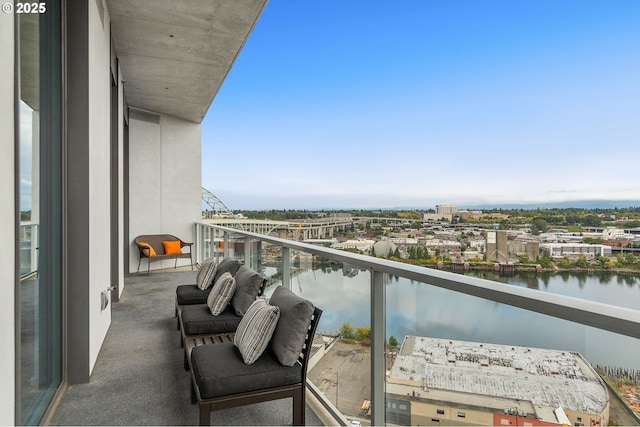 balcony featuring a water view