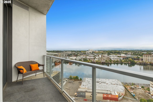 balcony featuring a water view