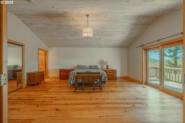 bedroom featuring baseboards, access to outside, vaulted ceiling, and light wood finished floors