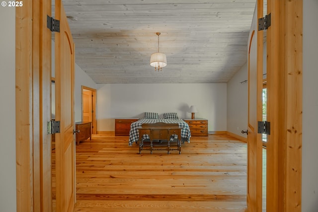 bedroom featuring wooden ceiling, baseboards, vaulted ceiling, and light wood-type flooring