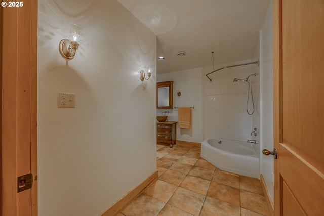 bathroom featuring baseboards, washtub / shower combination, and tile patterned floors