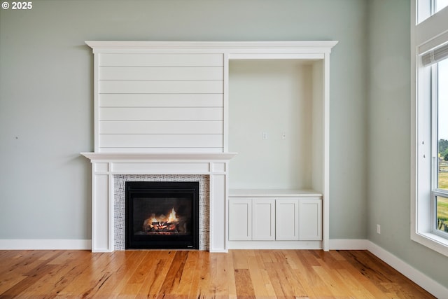80654 Polo Ridge Rd, Warrenton, OR 97146 - detailed view of wood finished floors and a tile fireplace