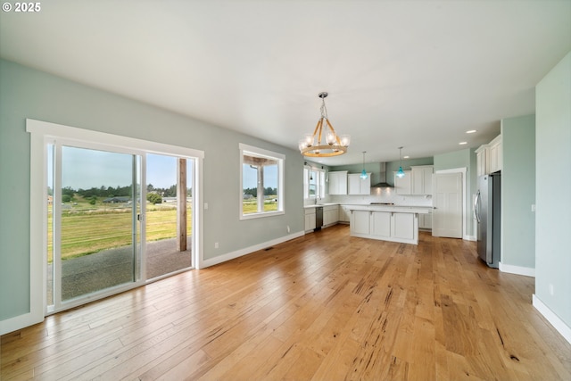 80654 Polo Ridge Rd, Warrenton, OR 97146 - unfurnished living room featuring a chandelier, light wood-style flooring, and recessed lighting
