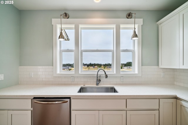 80654 Polo Ridge Rd, Warrenton, OR 97146 - kitchen featuring dishwasher, tasteful backsplash, white cabinets, and pendant lighting