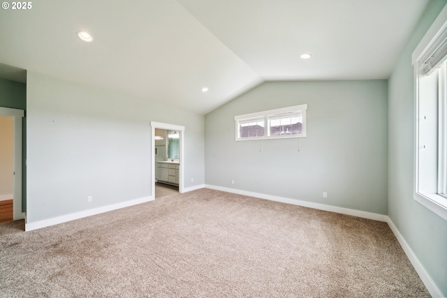 80654 Polo Ridge Rd, Warrenton, OR 97146 - unfurnished bedroom featuring light carpet, lofted ceiling, recessed lighting, and ensuite bath
