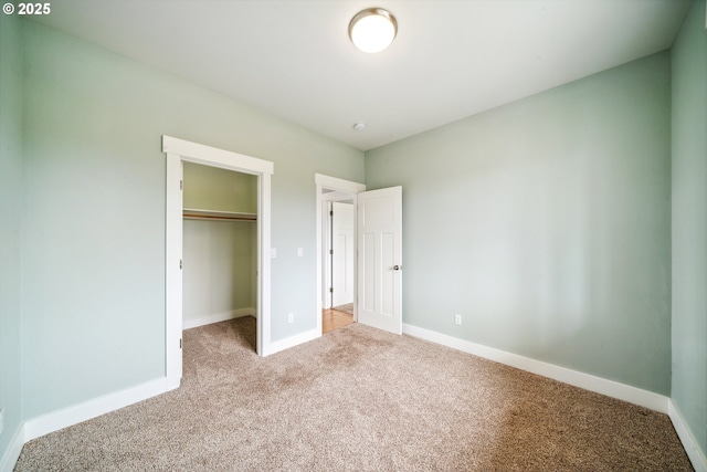 80654 Polo Ridge Rd, Warrenton, OR 97146 - unfurnished bedroom featuring carpet flooring, a closet, and a walk in closet