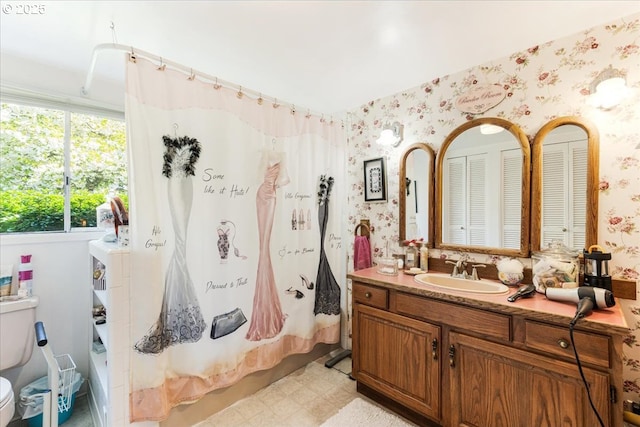 18050 SE Langensand Rd, Sandy, OR 97055 - bathroom featuring wallpapered walls, tile patterned floors, vanity, toilet, and shower / bath combo with shower curtain