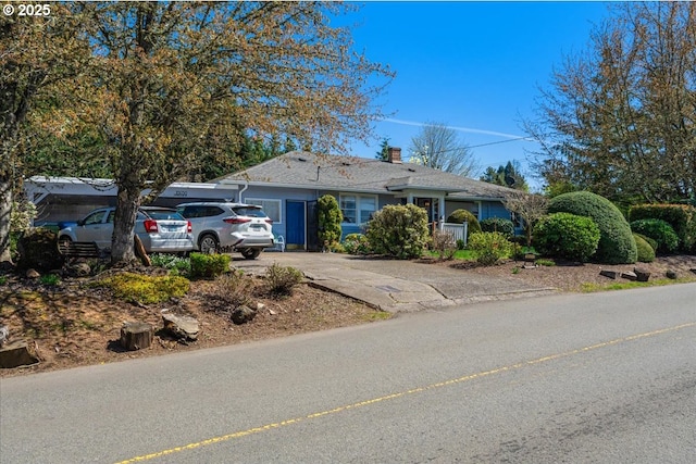 18050 SE Langensand Rd, Sandy, OR 97055 - ranch-style home featuring driveway and a chimney