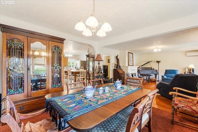 18050 SE Langensand Rd, Sandy, OR 97055 - dining area with a chandelier, a wall mounted air conditioner, and wood finished floors