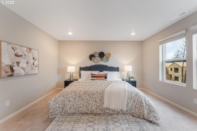 bedroom featuring light colored carpet