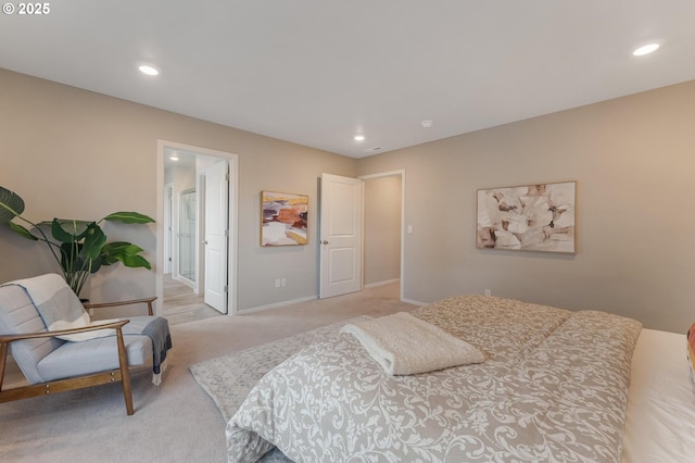 carpeted bedroom featuring ensuite bathroom