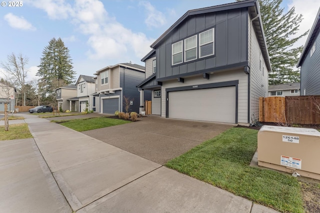 view of front of home with a garage and a front lawn